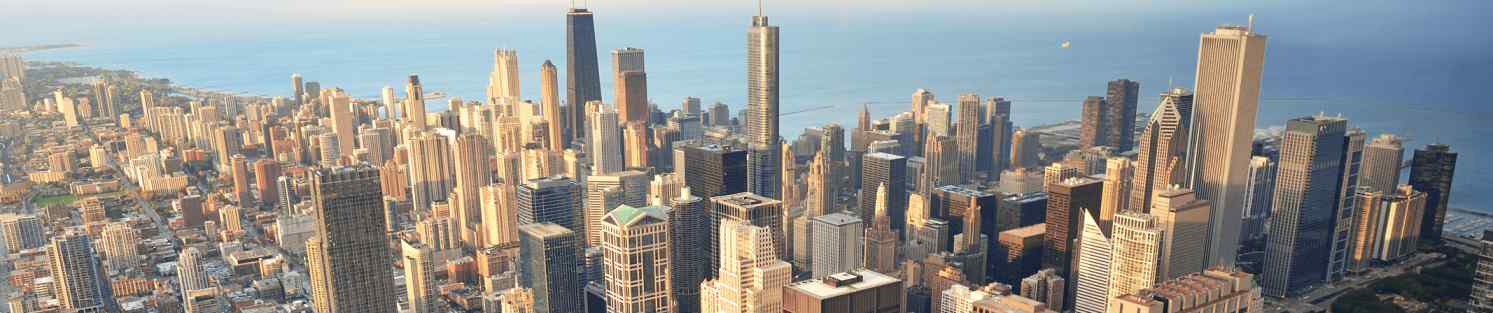 Blog 41 A panorama of a city skyline at sunset.
