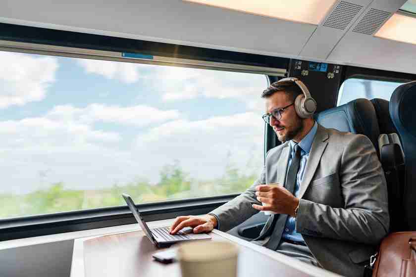 Hire2Retire Phase 5.6: Event Processing Reports, Freshservice ITSM Integration, Rippling HRIS Support, and More 1 A Businessman on a train working on his business's Hire2Retire workflow