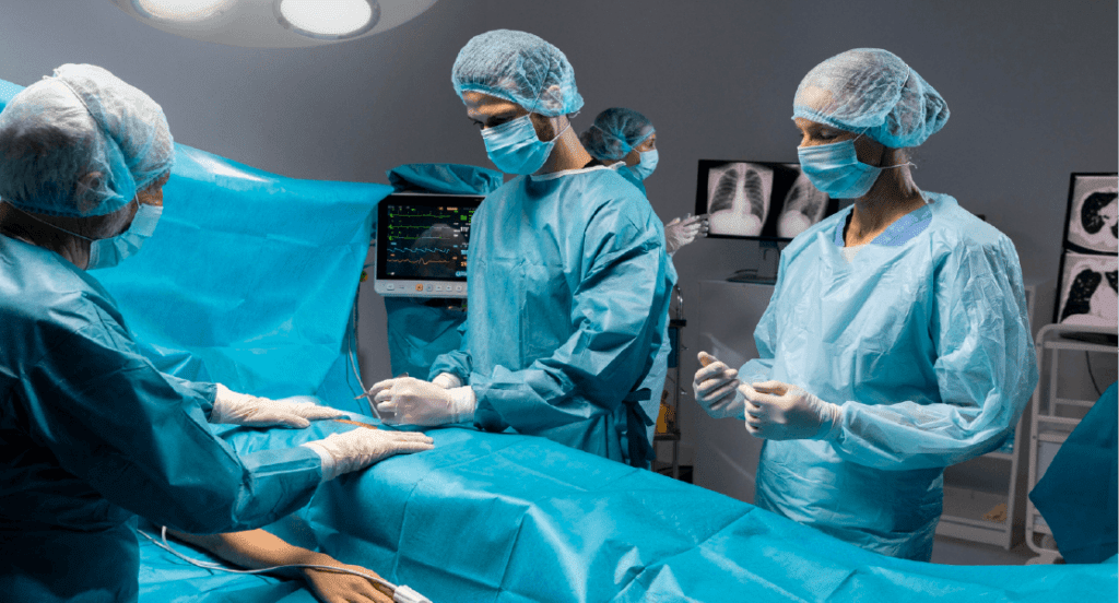A team of medical professionals in blue scrubs is engaged in a surgical procedure in a sterile operating room.