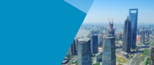 A city skyline with contemporary skyscrapers shining in the daylight.