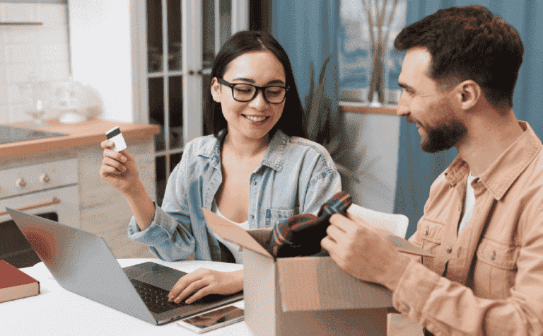 Blog 123 A woman holding a credit card makes an online purchase.