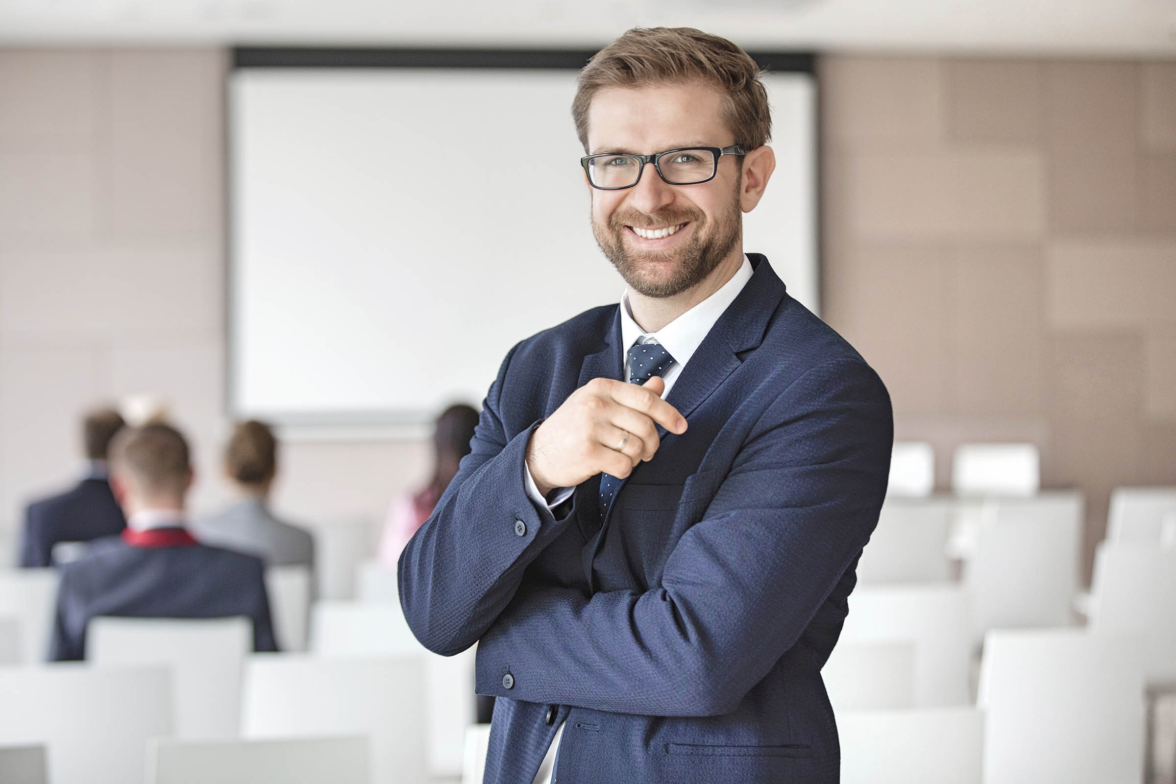 How To Homepage 1 Portrait of happy businessman standing in seminar hall using Hire2Retire