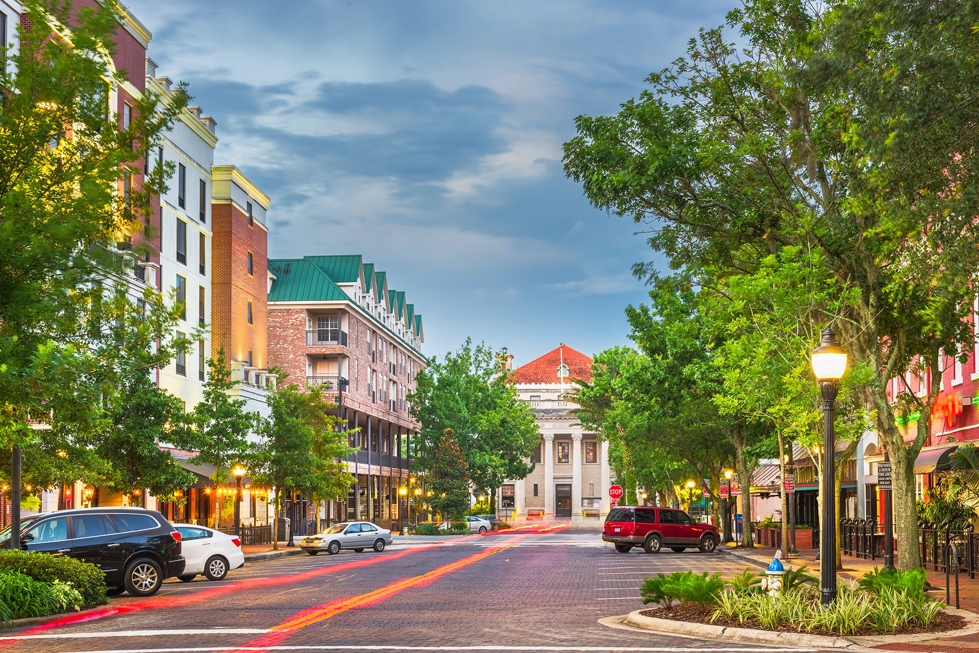 A street in downtown Gainesville, Florida at dusk.
