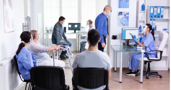 senior-man-sitting-in-hospital-waiting-area-of-hire2retire-customer