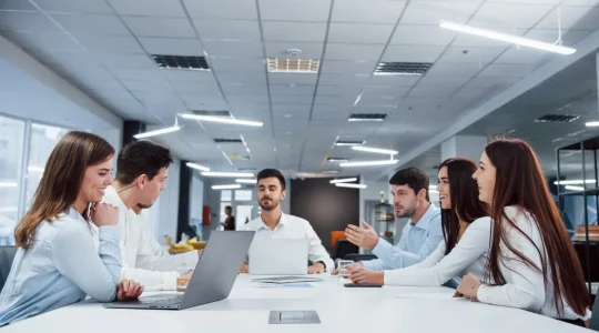 Corporate employees discussing how to use Paylocity webhooks with Hire2Retire