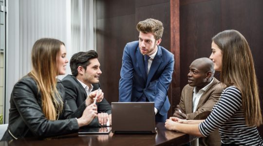 Group of professionals discussing how to create Workday Okta Integration