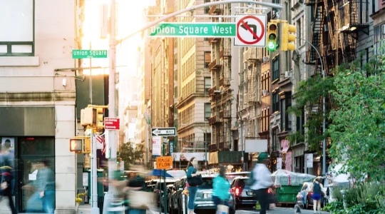 A busy city street intersection filled with people and cars moving from place to place. Similarly, Hire2Retire creates paths that move employee data from Deltek Costpoint to Google Workspace.