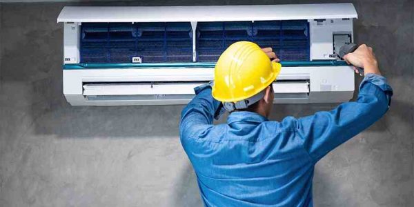 A man fixing Air Conditioner