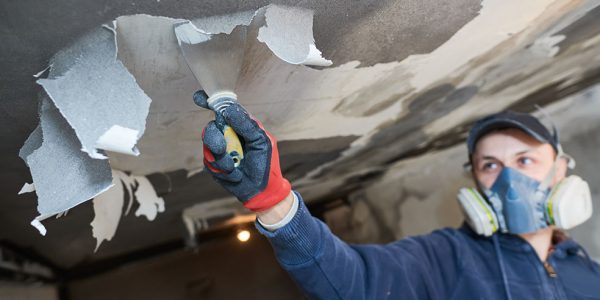 Fire damage and restoration indoor interior removing damaged paint layer